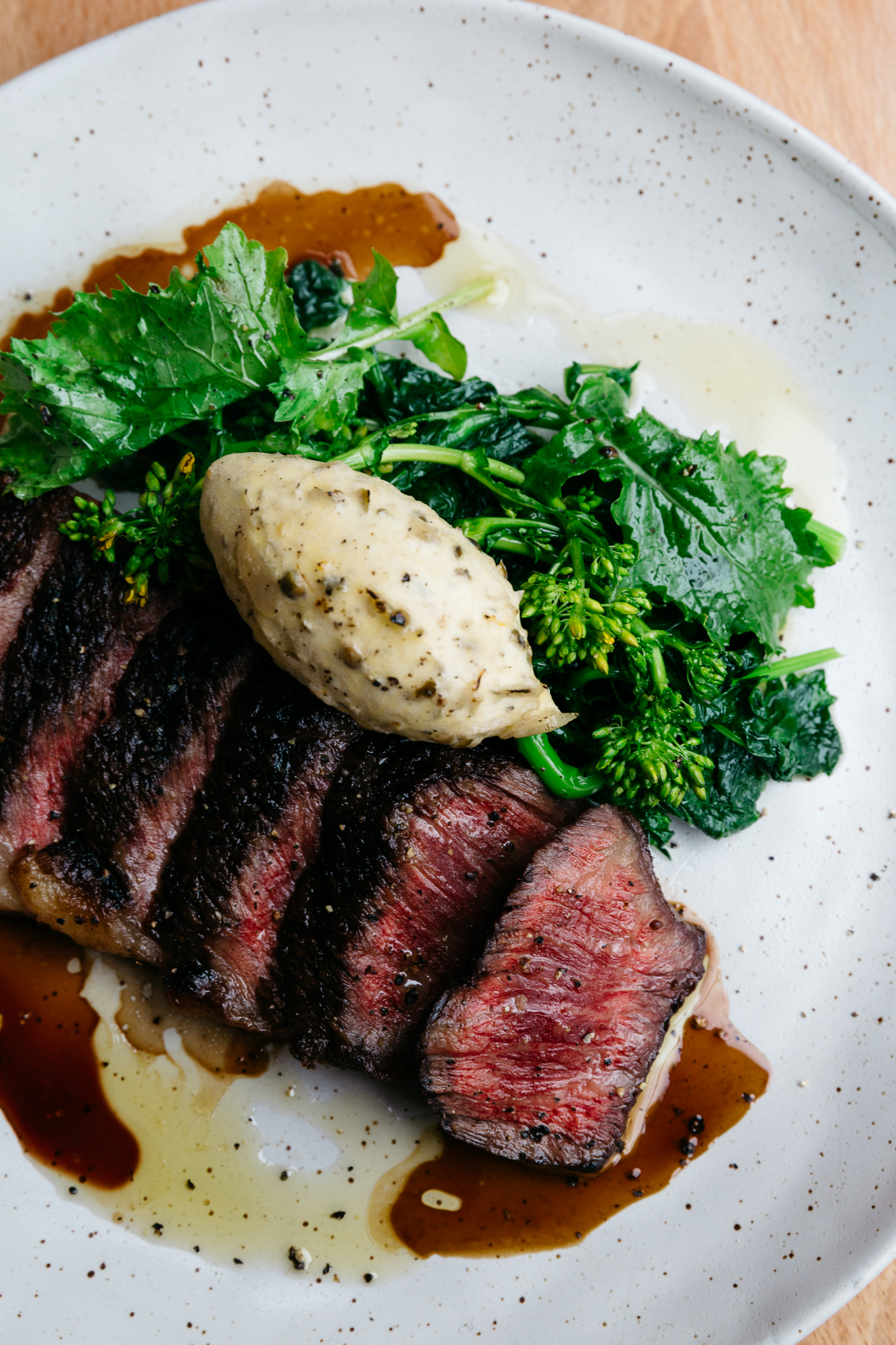 Wagyu with peppercorn and anchovy butter and braised cime di rapa at Orso Kensington