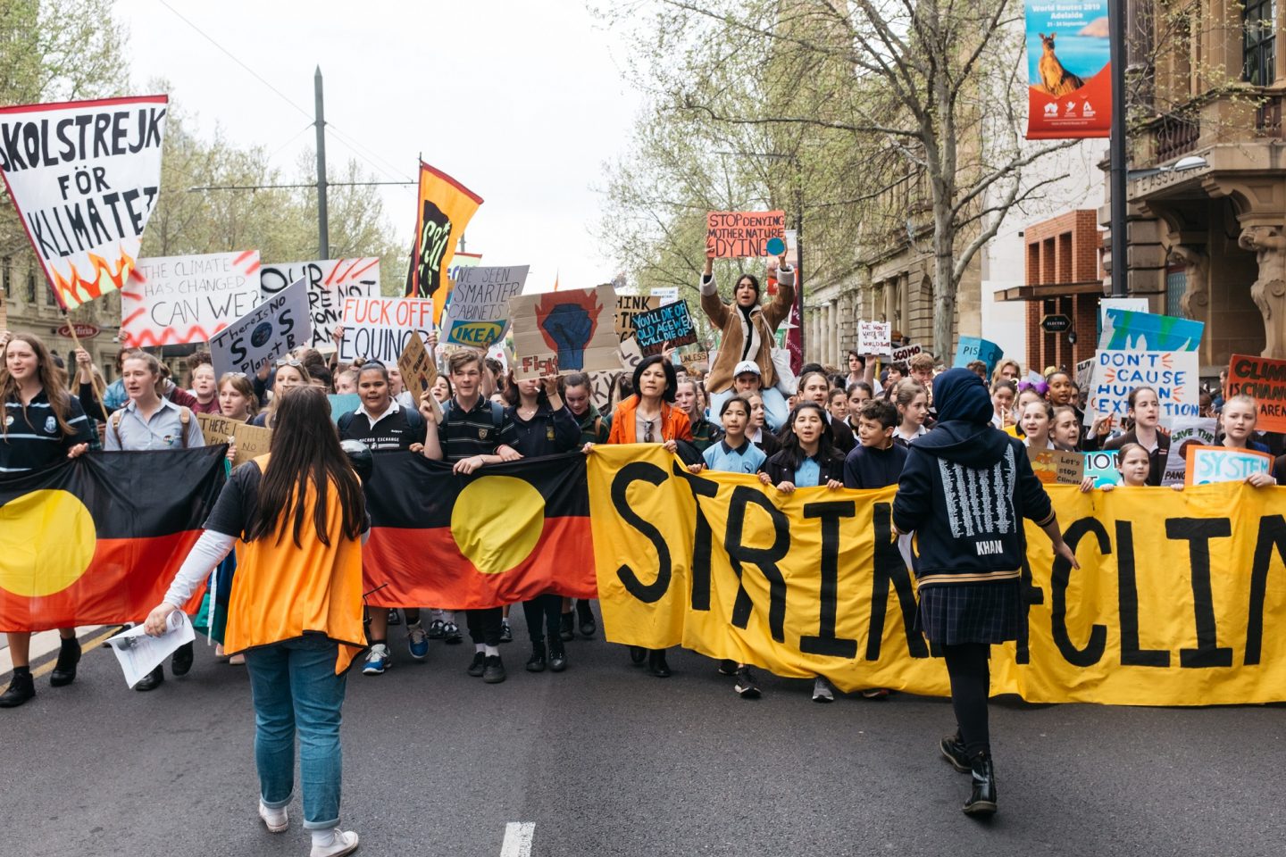 Climate strike demonstrators march down King William Street, Adelaide
