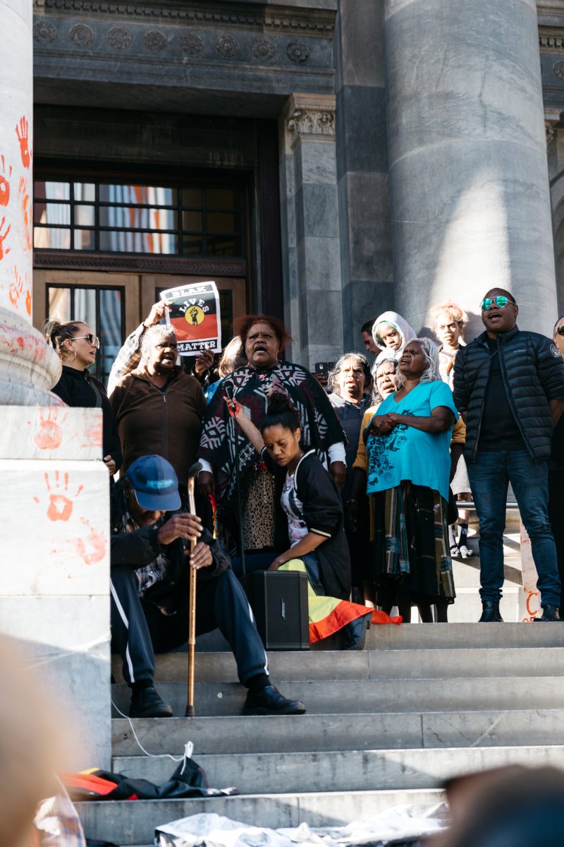 Hundreds rally in front of Parliament House in solidarity with the Yuendumu community