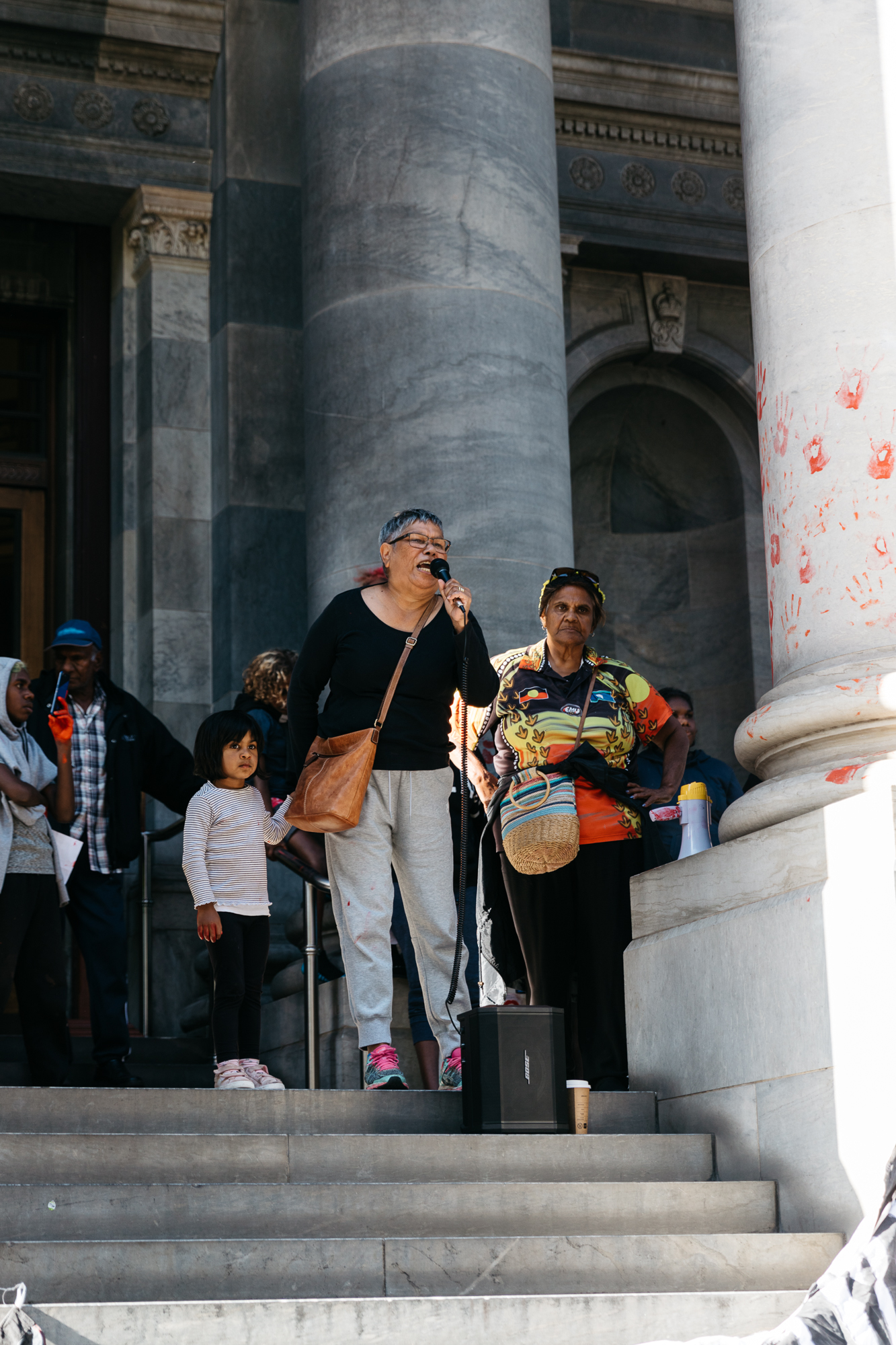 Hundreds rally in front of Parliament House in solidarity with the Yuendumu community