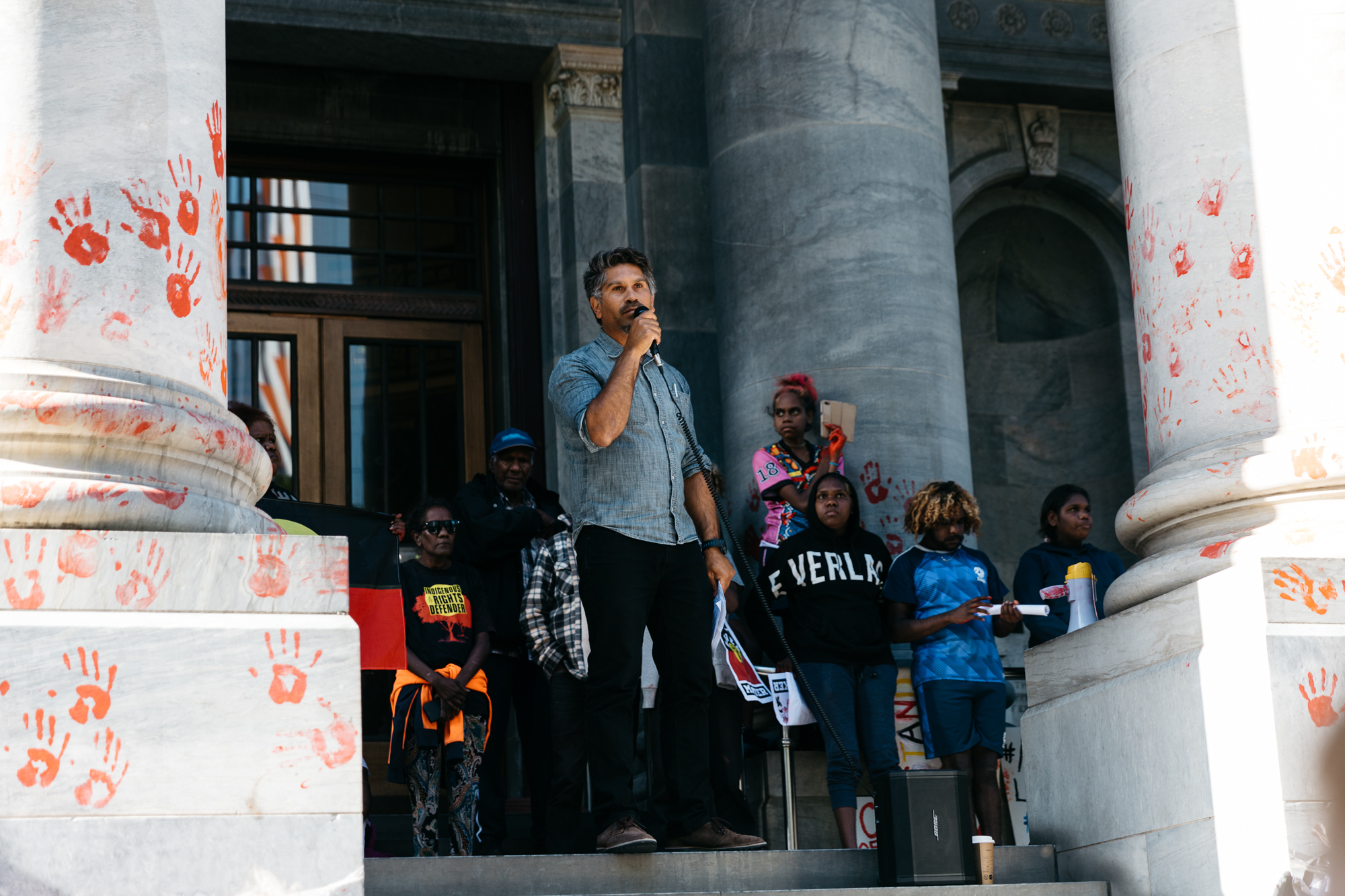 Hundreds rally in front of Parliament House in solidarity with the Yuendumu community