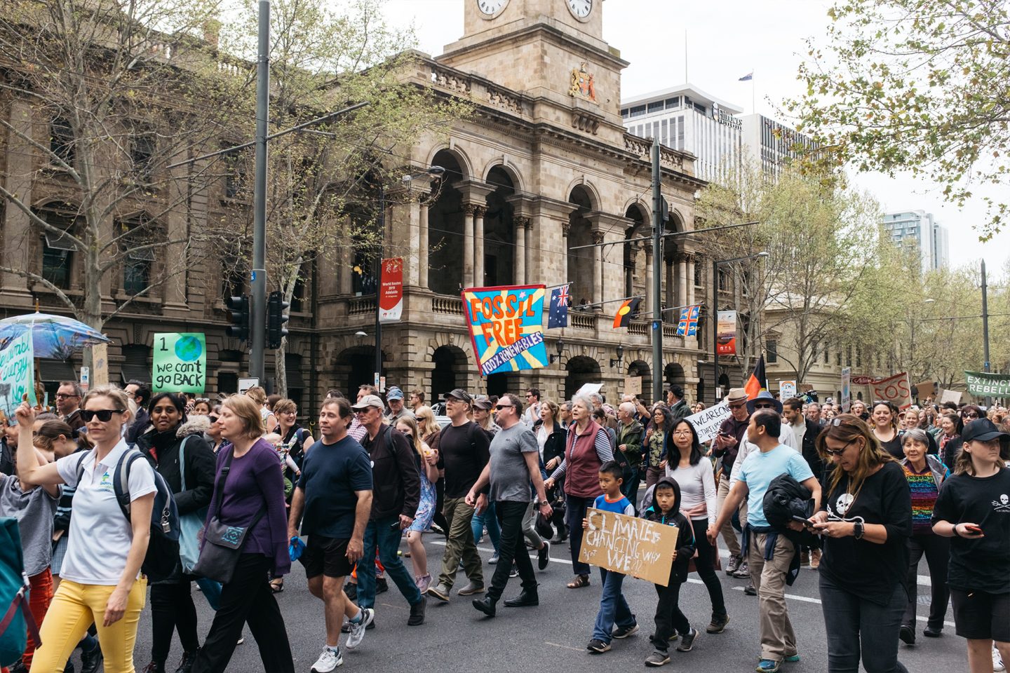 Climate demonstrators march past Adelaide Town Hall